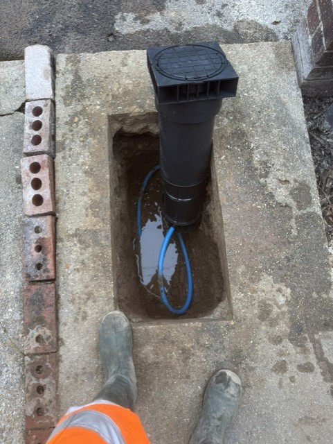 New boundary box chamber being set into a concrete path
